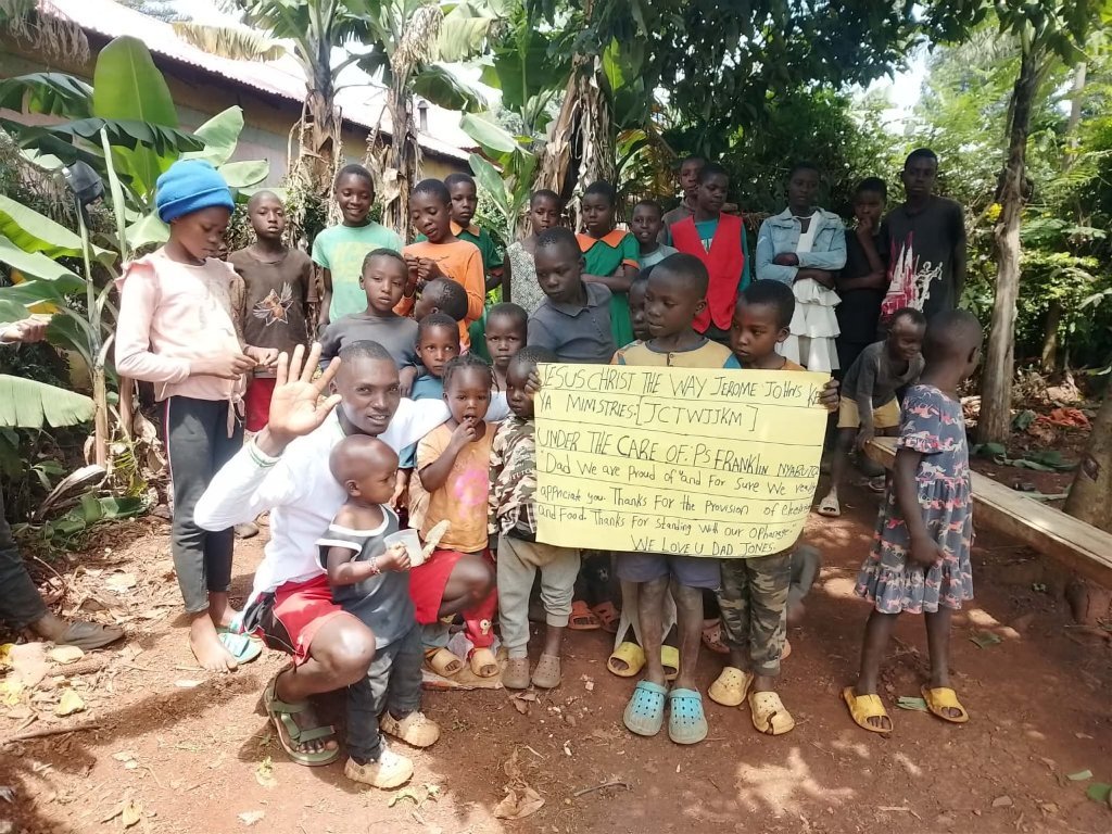 Pastor Frankline with the children of JCTWJKM