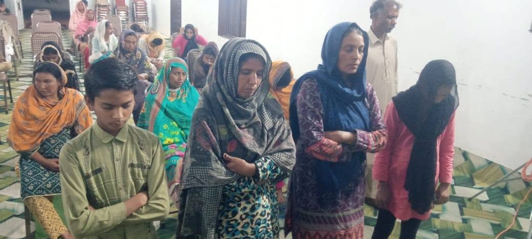 The church in Pakistan gathered with Bibles open
